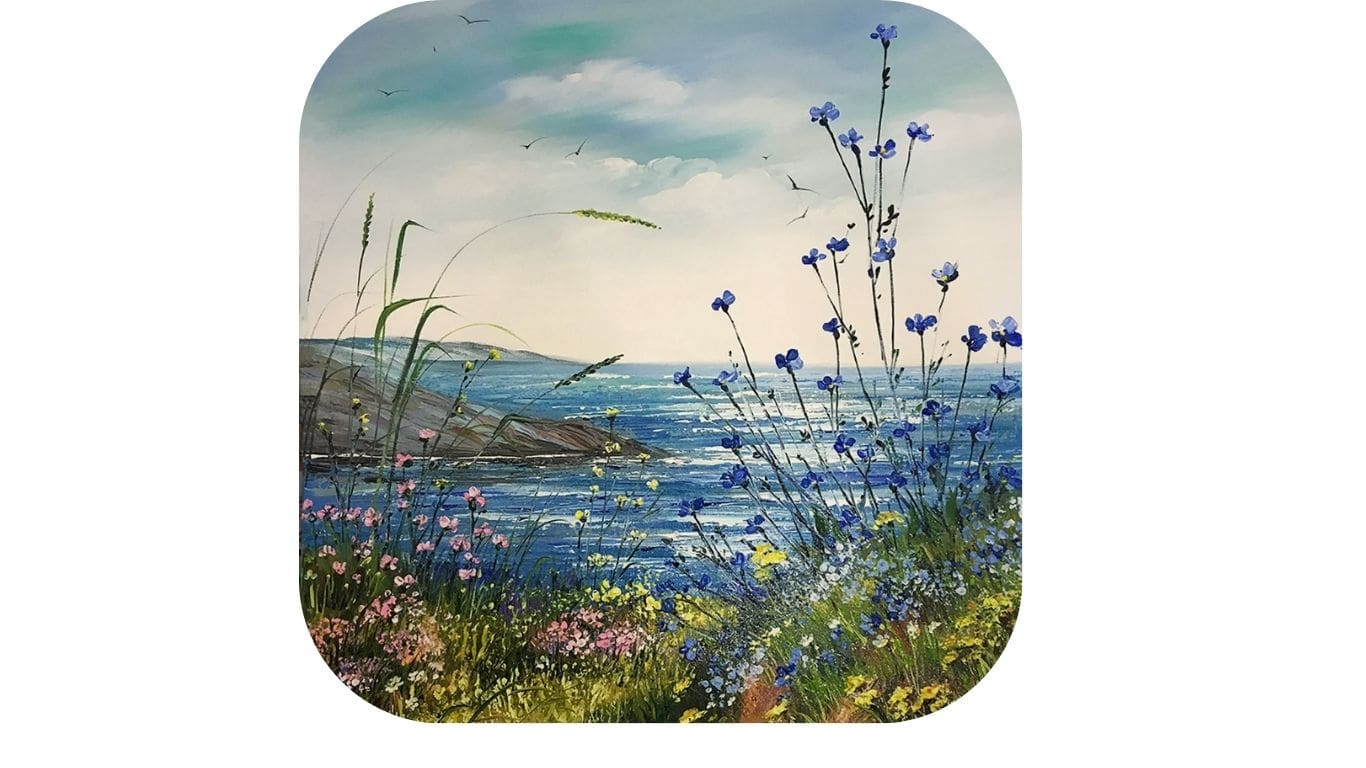 Wildflowers by the sea under a calm sky.