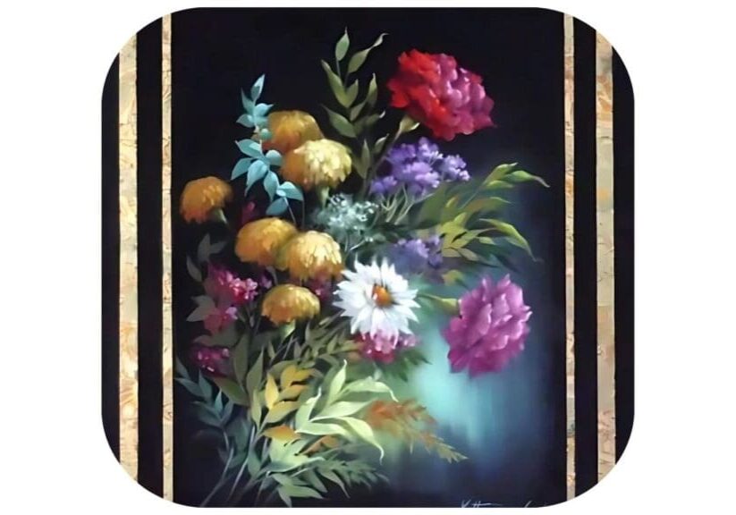 A vibrant bouquet of assorted flowers in a dark, artistic setting.